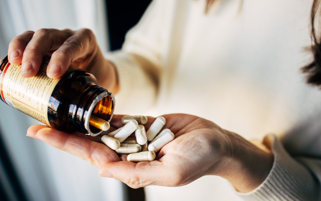 Woman taking vitamin pills